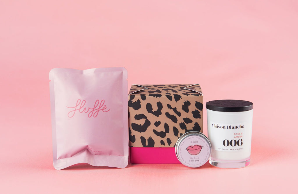 Gift box which includes fairy floss, a candle and lip balm